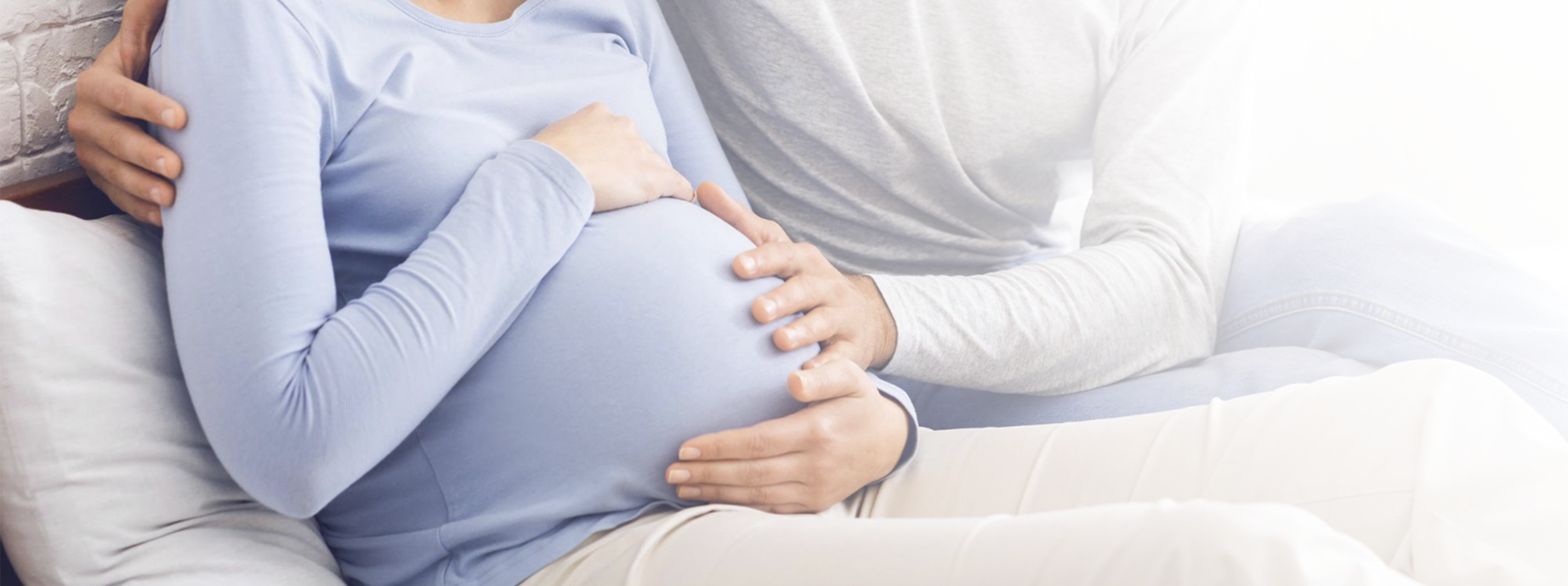 Expecting couple holding pregnant belly at home, supportive partnership and modern pregnancy journey