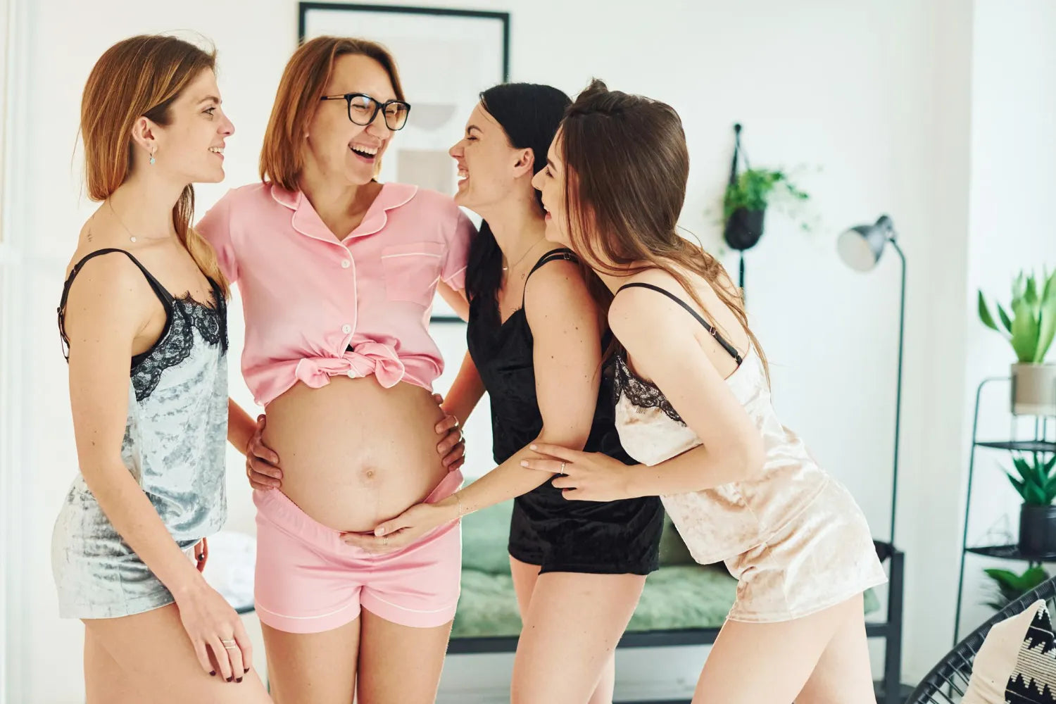 Pregnant woman celebrating with friends at home, joyful maternity lifestyle and modern motherhood support