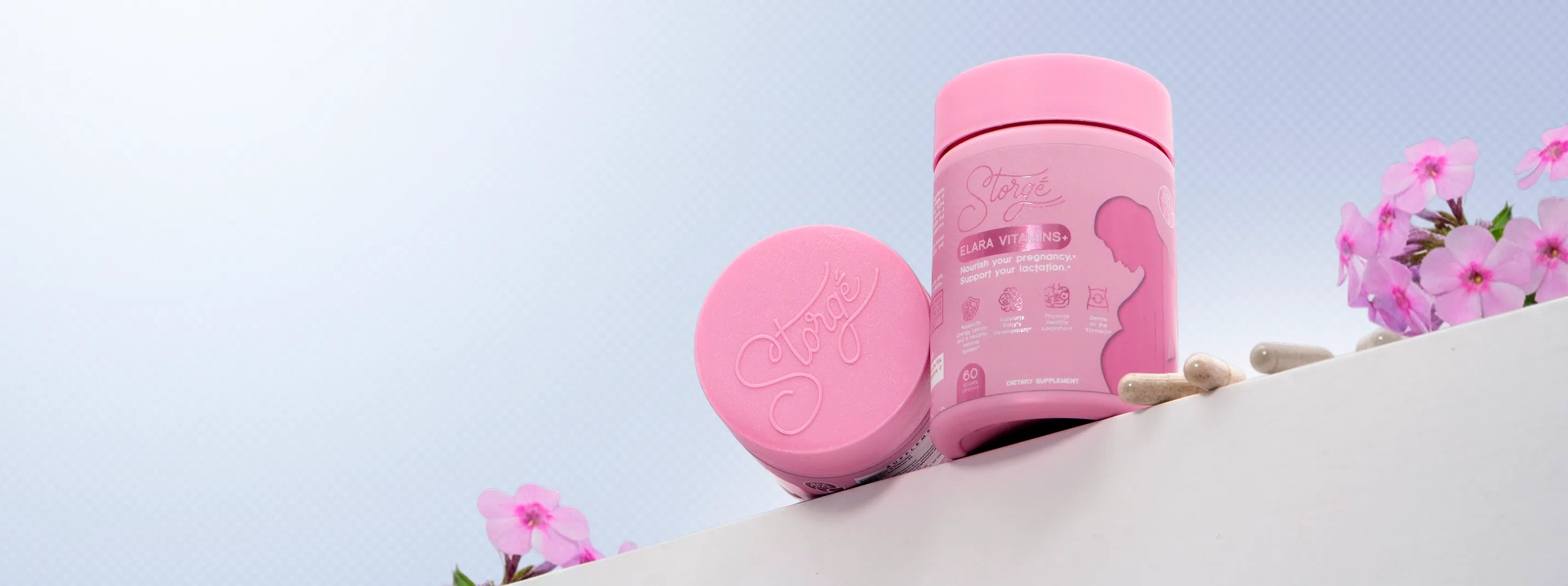 Storge Elara prenatal vitamins pink supplement jars with capsules, premium maternity wellness product display