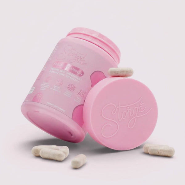 Storge Elara prenatal vitamins pink bottle with capsules, premium maternity wellness supplement